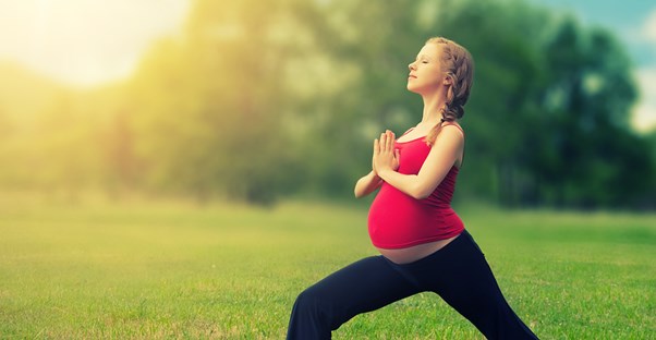 Pregnant woman working out in active wear