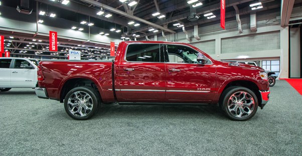 a red 2019 ram 1500 at an auto show