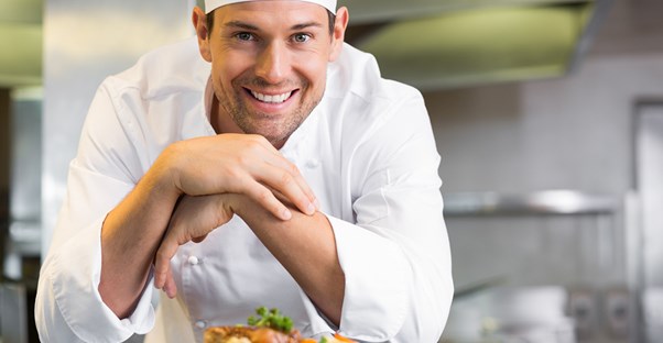 A chef poses with his food