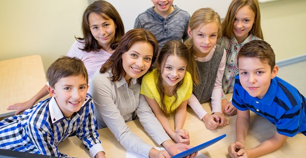A speech pathologist works with a group of young children
