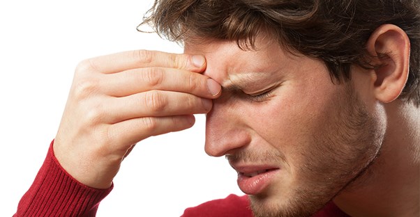 A man experiences a sinus headache