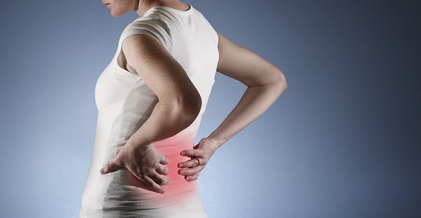A woman experiences back pain