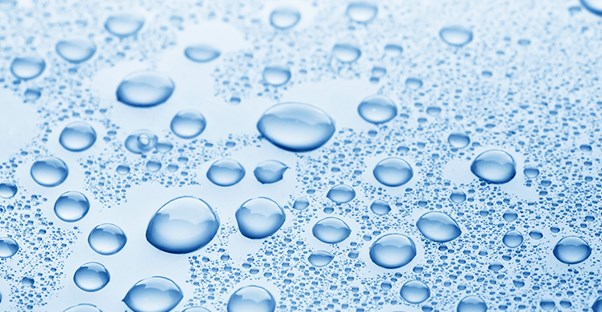 water droplets on glass to represent dry mouth