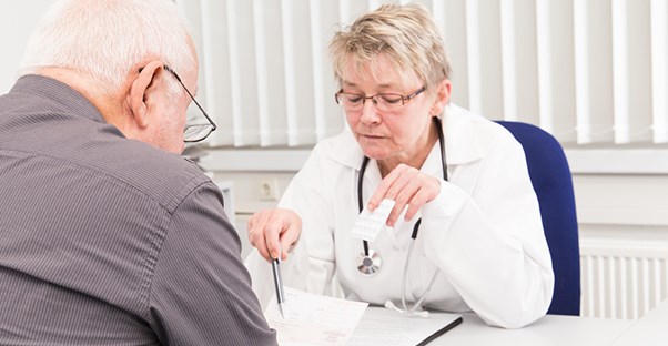 doctor discussing aphasia diagnosis with patient