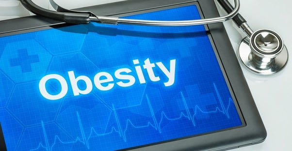 a tablet containing information on the causes of obesity