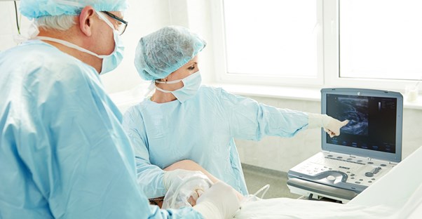 doctors performing a varicose vein surgery
