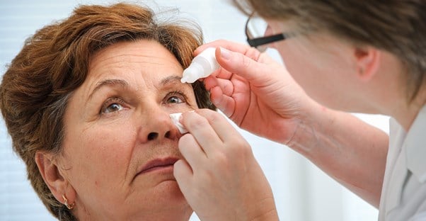 a woman being treated for macular degeneration