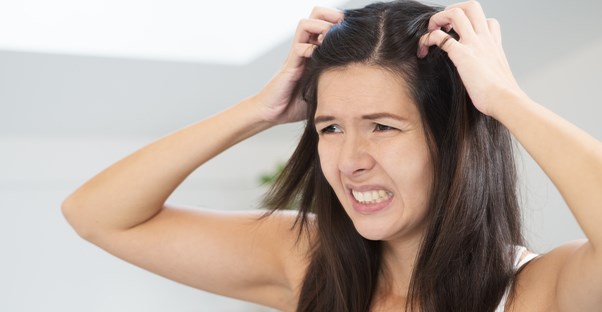 a woman who believes 5 dandruff myths
