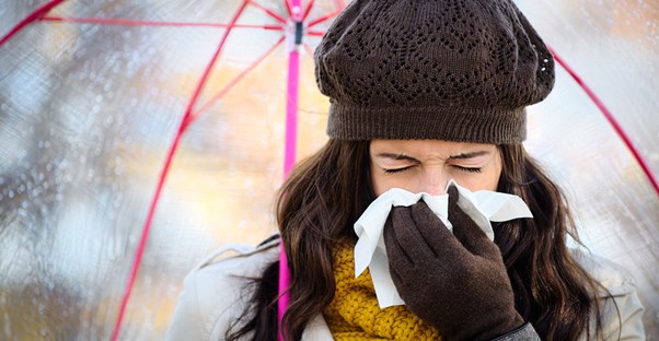 a woman suffering from common cold symptoms