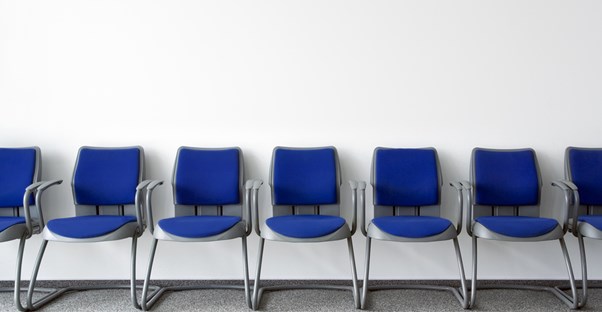 an empty waiting room to see a doctor about genital herpes