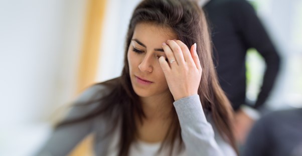 a woman wondering what causes headaches