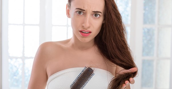 A woman treats her hair loss
