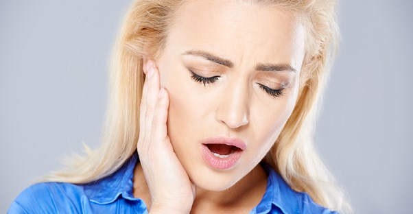 a woman wondering what causes canker sores