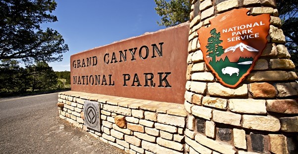 a stone entrence sign to Grand Canyon National Park