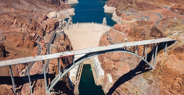 a bridge crosses in front of the Hoover Dam