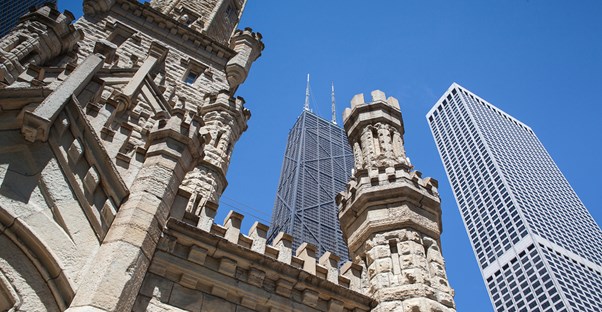 a view of the John Hancock building from the foot of the Chicago Water Tower