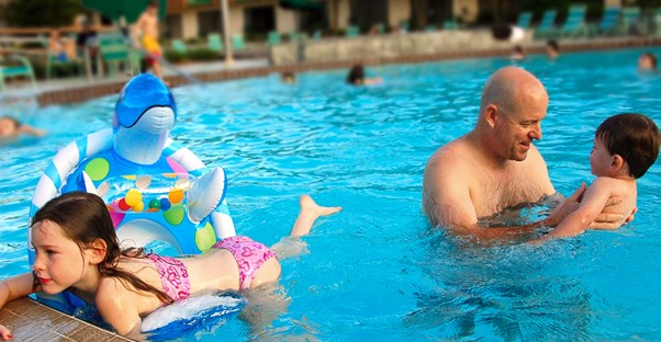 a family enjoys their time in a pool at a Dublin hotel