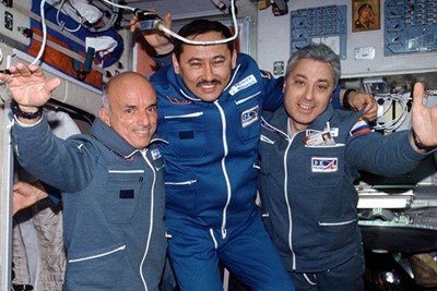 Dennis Tito, the first space tourist, and two astronauts.
