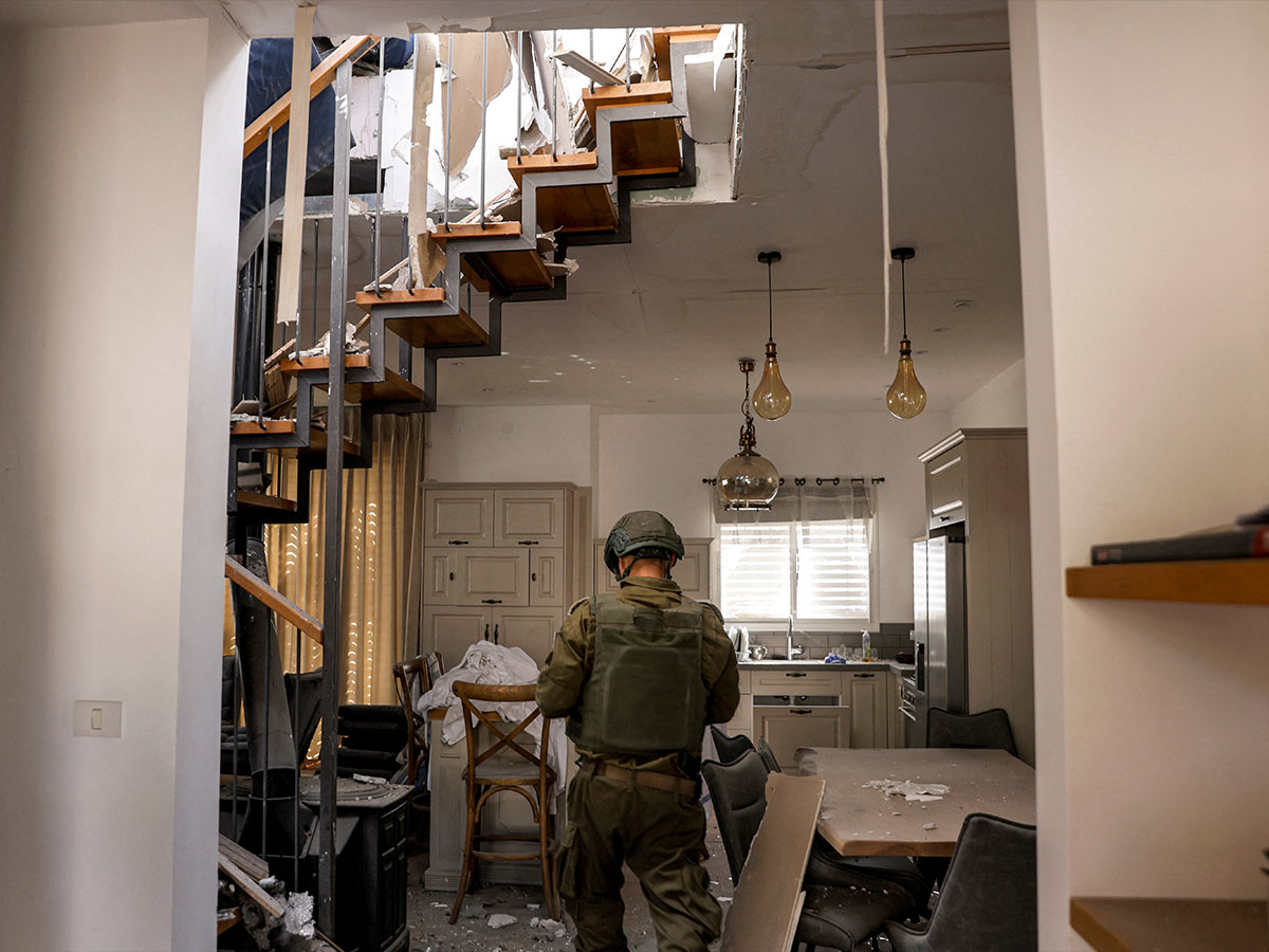 A Soldier in a Destroyed Home