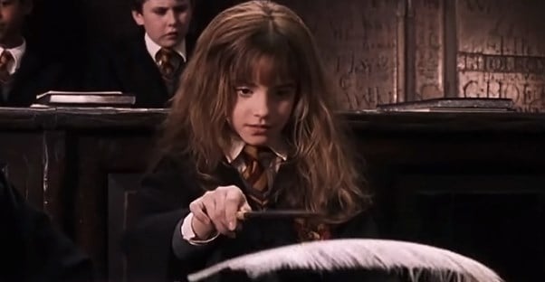 Hermione Granger working on a spell.