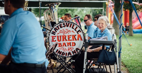 an older retired woman participates in a band