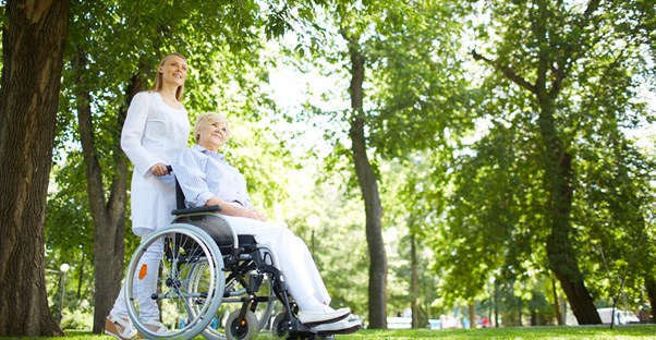 An elderly woman enjoys quality senior care paid for through long term care insurance.