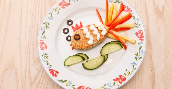 A healthy, quick snack for kids made out of veggies and crackers.
