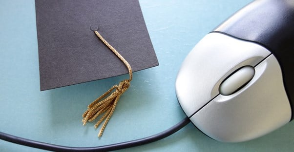 computer mouse and graduation cap