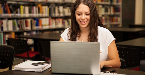 Young student searches for scholarships on the internet