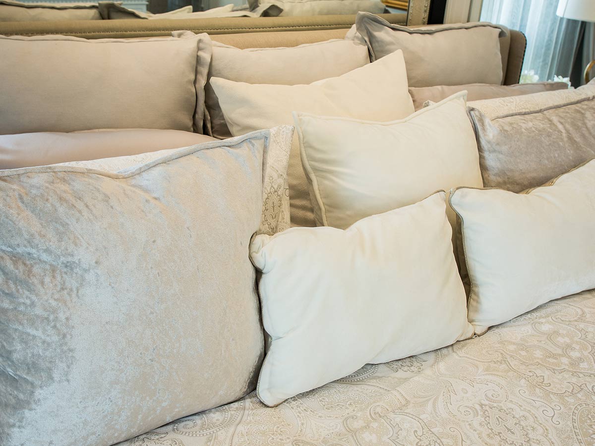 Tons of Throw Pillows on the Bed
