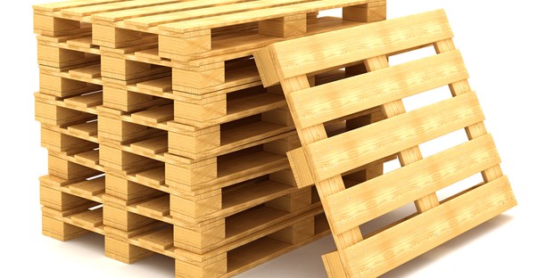 A stack of pallets to be turned into garage pallet racks