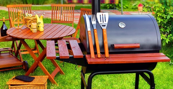 A grill set up with helpful gadgets and accessories