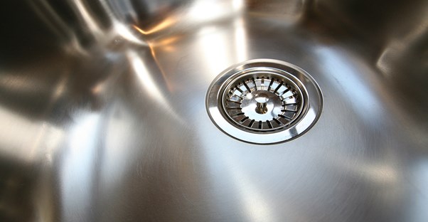 A stainless steel sink that has been properly cleaned.