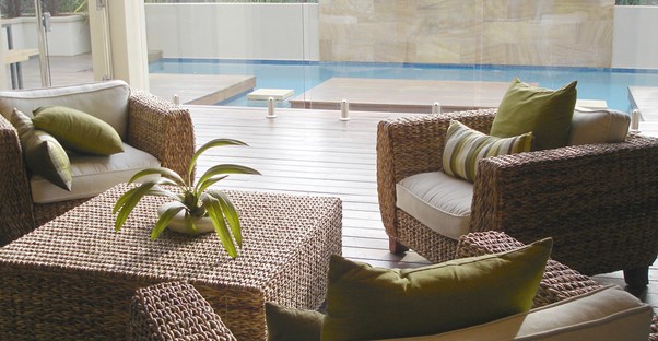 Patio furniture that has been protected by outdoor furniture covers.