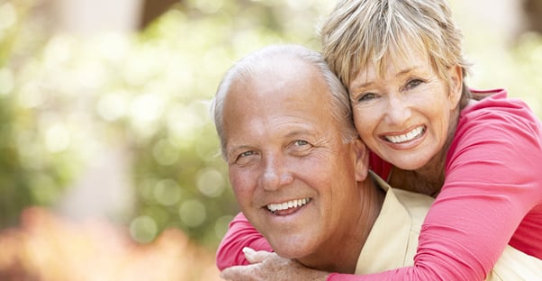 Happy senior couple considering a reverse mortgage