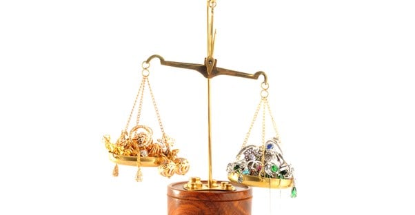 gold being weighed on a scale