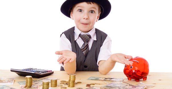 Adorable little boy in a vest, tie, and bowler hat shrugs in a I don't know gesture when asked what he knows about the child tax credit.