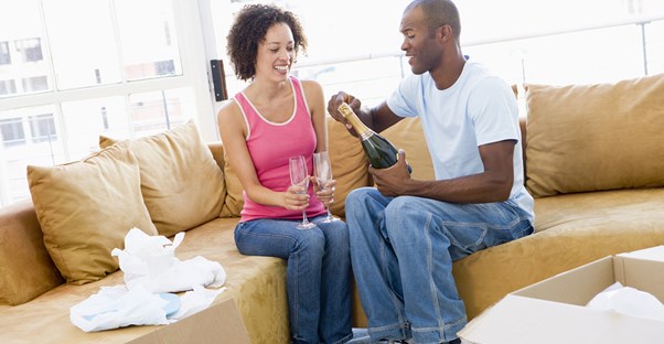 Couple Celebrating Successful Home Purchase
