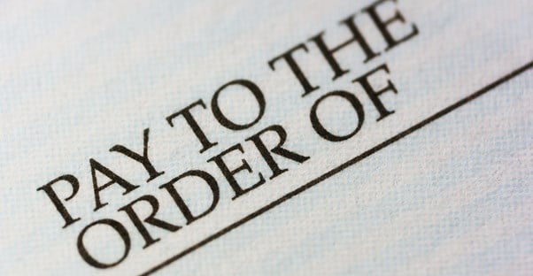 A close up of pay to the order of representing the personal security of check or money orders