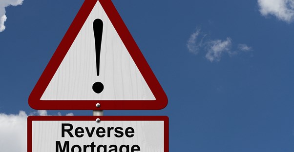 Sign that says reverse mortgage with an exclamation point