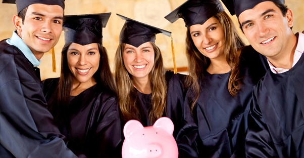 Group of students smiling because they don't have to worry about college expenses
