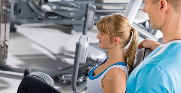 Woman working with a personal trainer