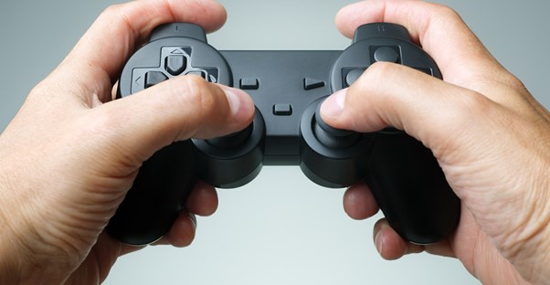 Person holding a playstation controller