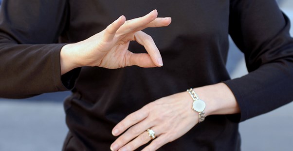 a woman communicating through learning sign language