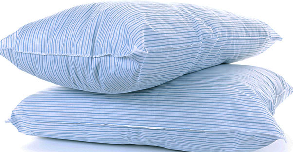 Two blue striped pillows are stacked on top of each other.