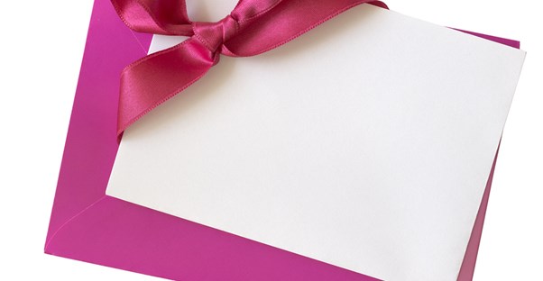 Pink and white wedding invitations made by the bride herself