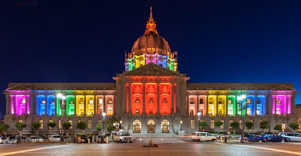 A building with rainbow lights to support gay rights.