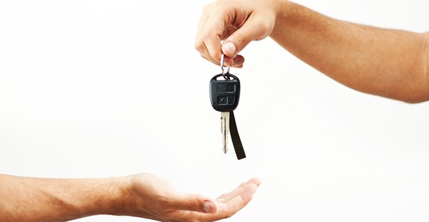 keys to a rental car being handed over