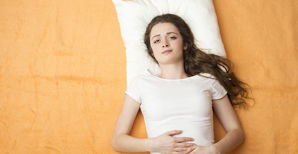 A woman contemplates her period