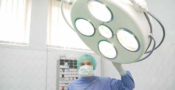 a surgeon about to perform liposuction